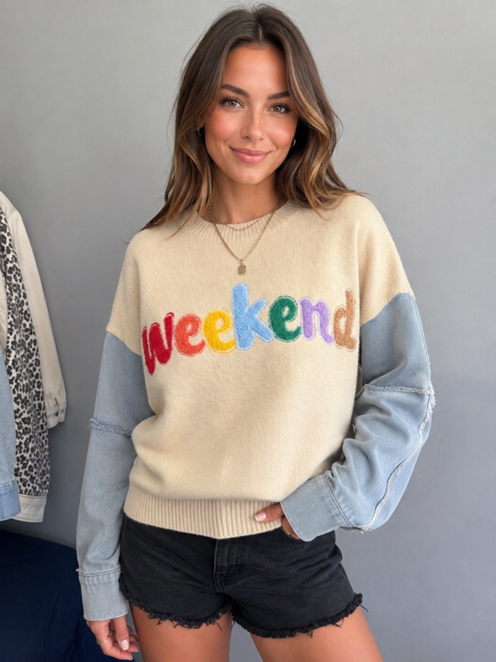 debut Cream Sweater with Multicolor "weekend" Lettering and Light Blue Sleeves